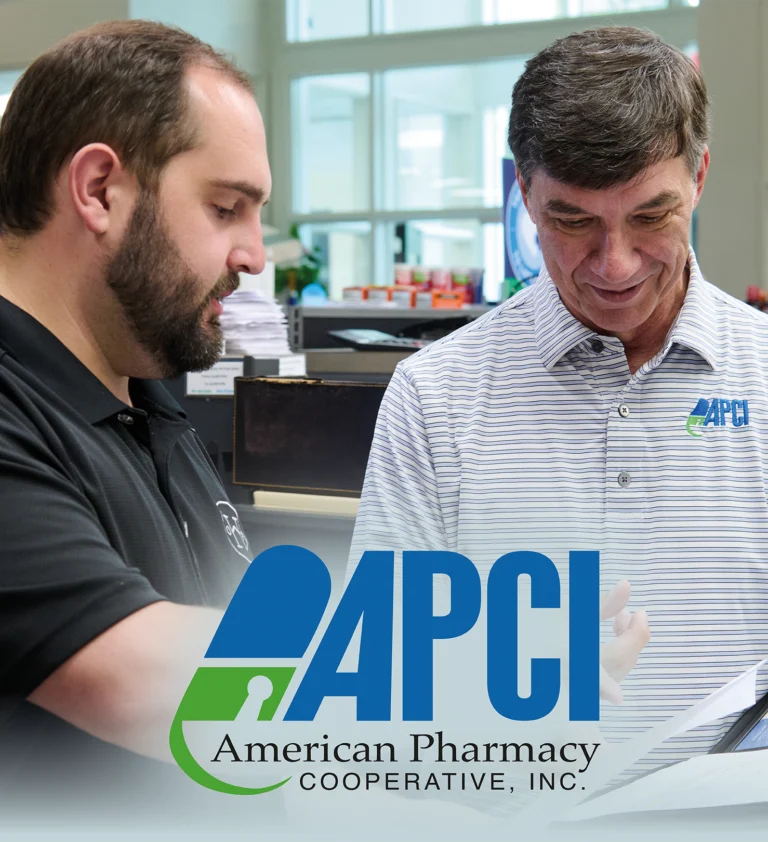 APCI Account Executive Mike Johnson speaks with [name] at APCI member Our Home Pharmacy